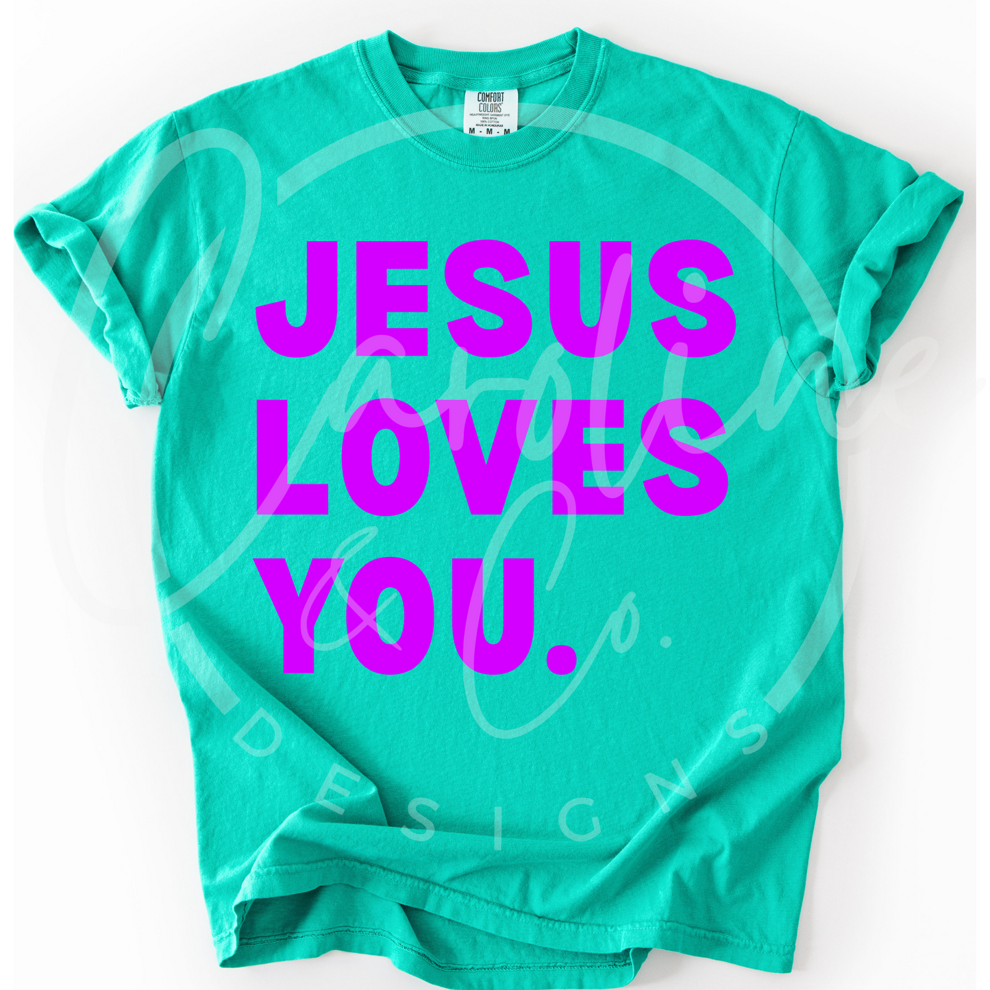 Green t-shirt with 'Jesus Loves You' in pink text on a white background